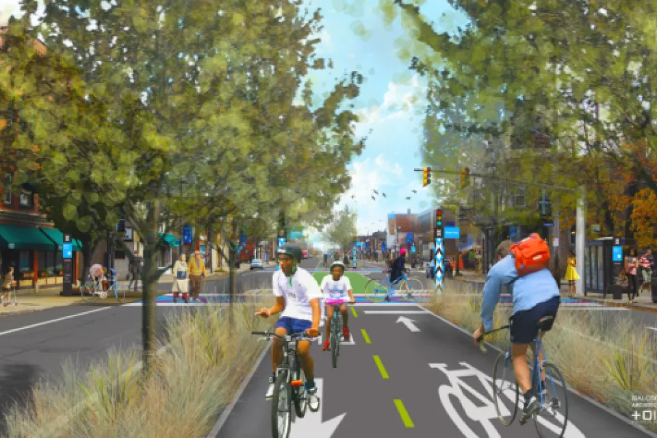 A conceptual rendering of the Superior Avenue Midway in Cleveland, showing people on bikes on a protected bike lane in the middle of a street.